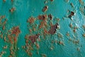 A rusty teal surface, with paint flaking Royalty Free Stock Photo