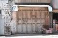 Rusting white metal door in Nablus