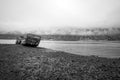 Rusty and abandoned old ship wreck from world war two laying on land in Mjoifjordur