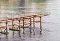 Rusty abandoned pier in sea