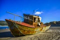 Rusty abandoned ship ashore at low tide Royalty Free Stock Photo
