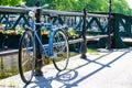 Rusty abandoned vintage retro bike parked by a bridge Royalty Free Stock Photo