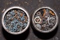 Rusty Aged Tin Of Screws. Old rusty screws in a metal jar and on the concrete floor background Royalty Free Stock Photo