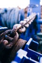 Rusty anchor chain on the bow. Part of mooring equipment. Blur. Close-up. Background