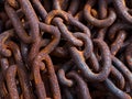 rusty anchor chains in a harbor Royalty Free Stock Photo