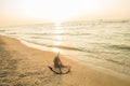 RUSTY ANCHOR WET BEACH SAND AND WHITE SEA WAVE FOAM Royalty Free Stock Photo