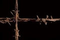 Rusty barb wire cross. Royalty Free Stock Photo