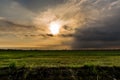 Rusty barbed wire fence under the blue sky in the evening with s Royalty Free Stock Photo