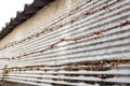 Rusty barbed wire and zinc metal fence Royalty Free Stock Photo