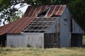 Rusty Barn in Texas with missing roofing