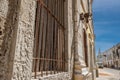 Rusty bars on a window with a street view of the Island of Mozambique