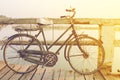 Rusty bicycle retro on wooden bridge with vintage style Royalty Free Stock Photo