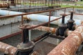 Rusty big tap and pipes and water treatment liquid Royalty Free Stock Photo