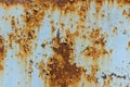 A rusty blue metal wall with fallen paint, a rusty background Royalty Free Stock Photo