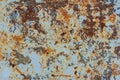 A rusty blue metal wall with fallen paint, a rusty background Royalty Free Stock Photo