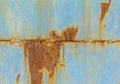 A rusty blue metal wall with fallen paint, a rusty background Royalty Free Stock Photo