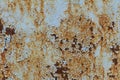 A rusty blue metal wall with fallen paint, a rusty background Royalty Free Stock Photo