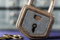 rusty blue padlock and brass key Royalty Free Stock Photo