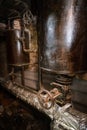 Rusty boiler room pipes. Old metal boiler generating heating and delivering it to home through pipeline. Hot water or gas is being Royalty Free Stock Photo