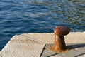 Rusty bollard on the dock Royalty Free Stock Photo