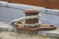 Rusty bollard and mooring lines on an old pier in Denmark Royalty Free Stock Photo