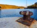 Rusty Bollard and sailing boat 2 Royalty Free Stock Photo