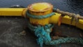 a rusty bollard with ship\'s ropes, Heimaey, Iceland