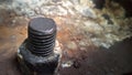 Corrosive rusted bolt with nut. Grunge industrial construction close up. Royalty Free Stock Photo