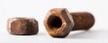 A rusty bolt and nut on a white surface Royalty Free Stock Photo