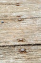 Rusty bolt on wood floor Royalty Free Stock Photo