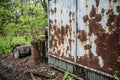 Rusty booth and barrels in abandoned Pripyat