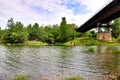 Rusty bridge over the river Royalty Free Stock Photo