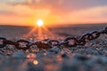 Rusty broken chains on the ground at sunrise symbolizing the dawn of freedom and new beginnings Royalty Free Stock Photo
