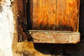 The rusty and broken hasp of the old and broken wooden window of Chinese house Royalty Free Stock Photo