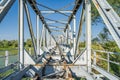 Rusty and broken railroad bridge connecting Poland and Germany over Oder river