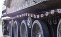 Rusty broken tracks with track rollers of a wrecked tank. Russian battle tank destroyed during the fighting during the Russian Royalty Free Stock Photo