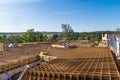 Reinforcing steel mesh on building site in green summer scenery on blue sky background