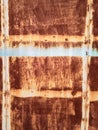 Rusty brown metal wall with yellow patterns. metal rust texture background Royalty Free Stock Photo