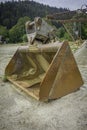 A rusty bucket is sitting on the ground