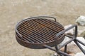 Rusty, burned barbecue grill made of metal. Rust on iron. Dirty grill