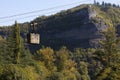 A rusty cable car hangs over the river in Chiatura, Georgia - Mining Town