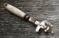 Rusty can opener with wood handle Royalty Free Stock Photo