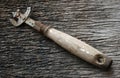Rusty can opener with wood handle Royalty Free Stock Photo