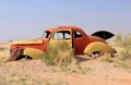 Rusty car wreck at last station in Namib desert