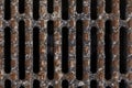 Rusty cast iron grill for water drainage or ventilation grille, for background.