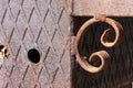 Rusty cast-iron ornament/decor. Metallic grill. Closeup. Royalty Free Stock Photo
