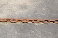 rusty chain on concrete ground