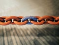 Rusty chain with a corroded weak link Royalty Free Stock Photo