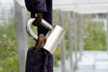 Rusty chain covered with cloth on which hangs a pendant lock, the lock on the railing entrance is closed Royalty Free Stock Photo