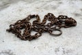 Rusty chain on floor Royalty Free Stock Photo
